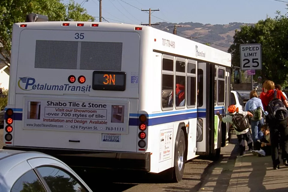 Passengers boarding a Petaluma Transit bus.